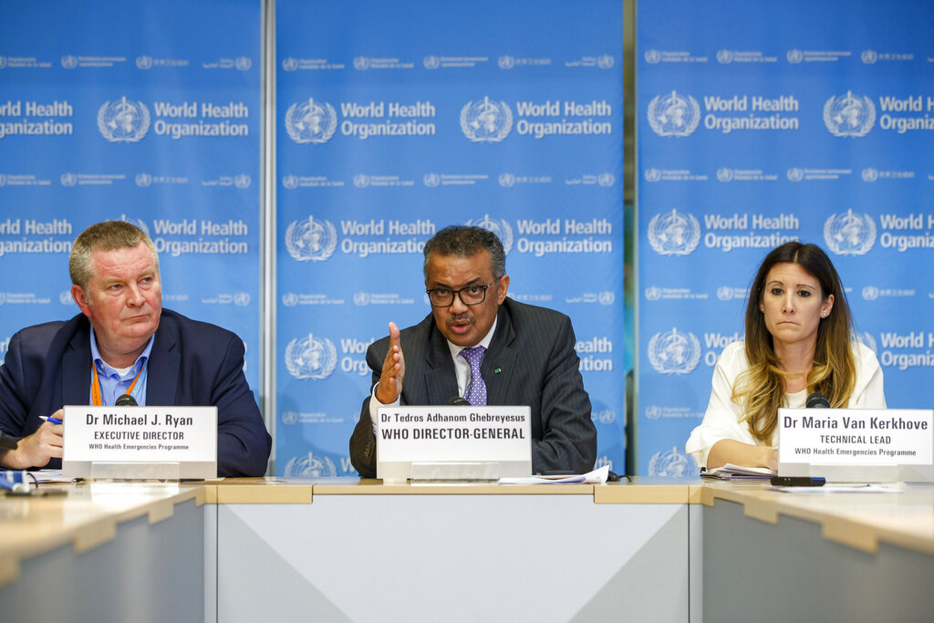Monday, March 9, 2020, Tedros Adhanom Ghebreyesus, director general of the World Health Organization, centre, speaks during a news conference on updates regarding on the coronavirus COVID-19, at the WHO headquarters in Geneva, Switzerland. Accompanying Tedros are Michael Ryan, left, executive director of WHO's Health Emergencies program, and Maria van Kerkhove, right, technical lead of WHO's Health Emergencies program. The way WHO handled the global response to the COVID-19 pandemic is under scrutiny, facing calls for the U.N. health agency to be overhauled and WHO has bowed to demands for an independent review. (Salvatore Di Nolfi/Keystone FILE via AP)